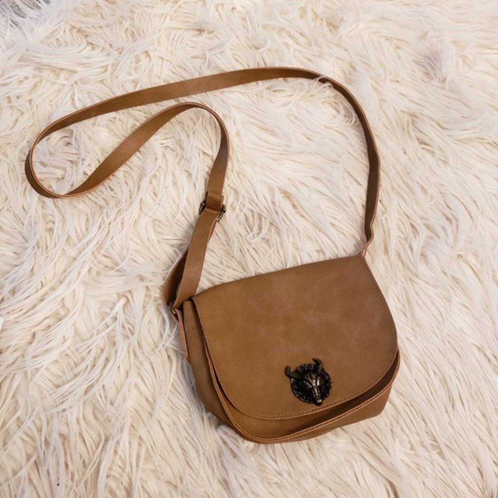 Tan crossbody with bull head on front‎